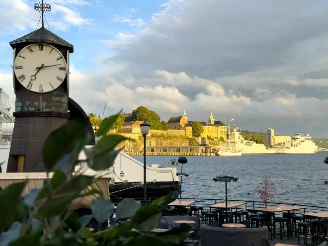 Akershus Fortress and naval vessels across Oslo's waterfront
